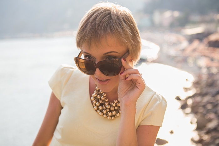 thecablook darya kamalova fashion blog street style monterosso al mare cinqueterre chicwish yellow baby doll dress asos gold wedges giant vintage sunglasses furla clutch hm necklace pixie hairtcut short hair blonde-50